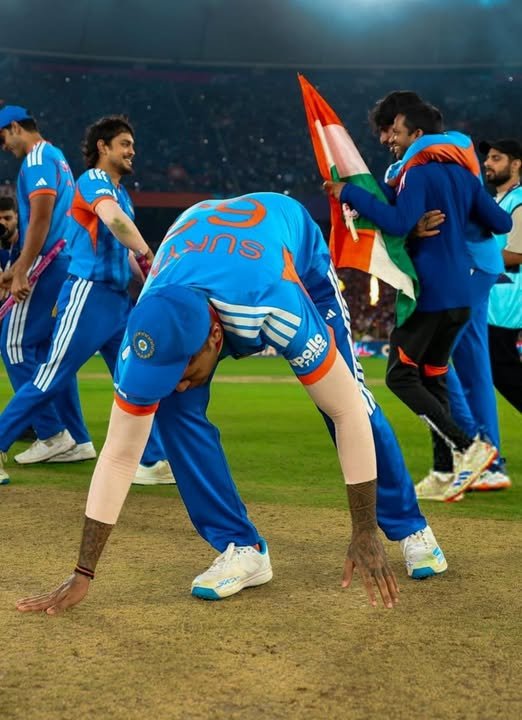 Captain Suryakumar Yadav touching the Ahmedabad pitch after leading India to the ICC Men's T20 World Cup 2026 victory. 